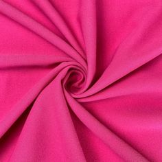 a close up view of the pink fabric that is very soft and bright, it looks like