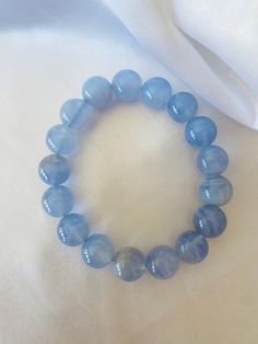 Stunning bracelet high grade natural blue lace agate bracelet !  12mm blue agate is often associated with the element of water and is said to promote spiritual growth and enlightenment. Blue Lace Agate Bracelet, Water Element, Calm Water, Agate Bracelet, Blue Lace Agate, Blue Agate, Nature Bracelets, Lace Agate, Spiritual Growth