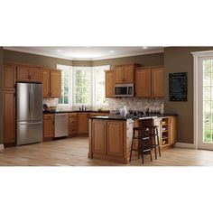 a kitchen with wooden cabinets and stainless steel appliances