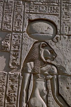 an ancient egyptian carving depicting the god osirit