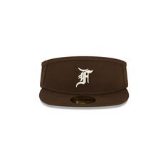 The Fear of God Essentials Walnut 59FIFTY Visor features an embroidered Fear of God logo at the front panels with the official MLB Batterman logo at the rear and a green undervisor. Brown Fitted Hat With Flat Bill For Streetwear, Brown Flat Bill Fitted Hat For Streetwear, Collegiate Visor Fitted Hat For Streetwear, Brown Flat Brim Fitted Hat For Streetwear, Classic Baseball Cap With Logo Patch, Brown Curved Brim Fitted Hat For Streetwear, Brown Curved Brim Fitted Hat For Sports, Brown Visor Hat For Streetwear, Fear Of God Logo