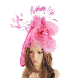 Spring Summer Hat & Fascinator Collection Ariel Fascinator Hat Gorgeous trimmed feathers surround large silk rose with a large saucer sinamay base Base measures about 12 inches wide Mounted with a matching headband, if you prefer a black brown silver or gold headband to match your hair please note this when you check out. can be made in many colour combinations It is mounted with a headband. We will always try and match the fascinator colour to the headband. If the colour is unavailable then Fitted Pink Fascinator With Feather Trim, Fitted Pink Mini Hat With Feather Trim, Pink Carnival Costume Hats, Pink Feather Fascinator For Royal Ascot, Pink Feathered Fascinator For Races, Spring Feather Headband For Races, Pink Carnival Headpieces, Pink Feathered Headpiece For Races, Pink Mini Hat With Feather Trim For Summer