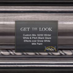 a sign that says get the look in front of a silver frame with black lettering