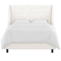 a bed with white linens and pillows on top of it, against a white background