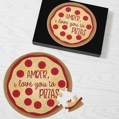 two personalized pizza coasters on a table with a piece missing from the puzzle