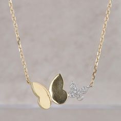 This ladies necklace is 18k white and yellow gold and has a yellow gold polished butterfly as well as a white gold diamond cluster butterfly paired with it. There are eighteen single cut diamonds that measure approx 0.06ctw and are G-H in color and SI2-I1 in clarity. The pendant is attached to a 1.15mm diamond cut cable chain that has a jump ring at 16", 15", and 14" in length so it can be worn at any of these lengths. The necklace is an original Patricia Robalino and measures 5/8" in length and 1/4" in height. The necklace weighs 3.67 grams. Condition: Pre-Owned *Disclaimer: Any estate piece may have scratches, nicks, chips, or dents due to previous wear but all the jewelry is checked and fixed like new to the best of our ability.* *All items are thoroughly inspected for quality assurance Butterfly-shaped Yellow Gold Jewelry With Diamond Accents, Luxury White Gold Necklaces With Butterfly Charm, Luxury White Gold Necklace With Butterfly Charm, White Gold Butterfly Necklace For Anniversary, Fine Jewelry Diamond Butterfly Necklace In Yellow Gold, Elegant Sterling Silver Butterfly Necklace In Yellow Gold, Diamond Butterfly Necklace In Yellow Gold, Yellow Gold Diamond Butterfly Necklace With Charm, Yellow Gold Diamond Butterfly Necklace