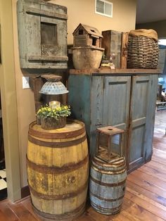 an old wooden barrel sitting on top of a hard wood floor