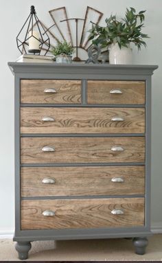 an old dresser has been painted gray and wood