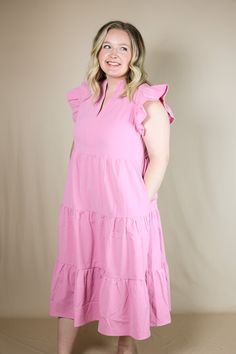 Our "Savannah Tiered Midi Dress" is a pink colored midi dress. It has three tiers and ruffle sleeves. It has a v-neckline. Our model is wearing a Large. Pink Midi Dress With Ruffle Sleeves For Summer, Pink Ruffle Sleeve Midi Dress For Spring, Pink Ruffle Sleeve Dress For Spring, Pink Tiered Midi Dress For Spring, Pink Ruffle Sleeve Dress For Brunch, Pink Tiered Dress With Ruffle Hem For Brunch, Pink Tiered Dress For Spring Brunch, Casual Pink Tiered Dress For Brunch, Pink Ruffle Hem Midi Dress For Spring