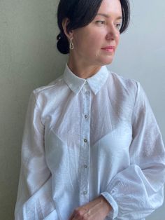 "Adou vintage style  white blouse with  puffy sleeves. Excellent vintage condition!  No holes or spots.  **Material: polyester  **Has no size tags, seems like fits sizes M/L. Model is size M and 170 cm 66.8\" height , bust 89cm/35.0\" **This item will come to you freshly laundered and ready to wear. **If you want to purchase more items, please message me, I will make a special price and delivery." White Long Sleeve Tops With Gathered Sleeves, White Button-up Blouse With Blouson Sleeves, White Blouson Sleeve Button-up Blouse, Daywear Shirt With Puff Sleeves, Puff Sleeve Blouson Shirt For Daywear, White Button-up Top With Blouson Sleeves, White Long-sleeve Shirt With Blouson Sleeves, White Puff Sleeve Top With Blouson Sleeves, White Long Sleeve Puff Sleeve Top For Daywear