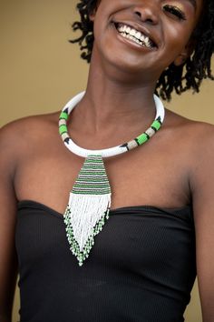 Unique African Maasai Handcrafted Beaded Necklace with an Elegant Look and Brilliant Finish. **GET FREE SHIPPING FOR ADDITIONAL ITEMS PURCHASED. Yes, Buy Multiple Items and pay shipping for 1 item only- The rest ships Free. (No Limits on the number of Multiple items). With a faster delivery time of 3 days via DHLExpress, Worldwide. Ordinary/Standard Shipping also available upon request. We Custom Make to Suit Your Taste. Available In All Colors and Sizes. For wholesale please chat me up for disc Traditional Handwoven White Beads, Traditional White Handwoven Beads, Traditional Green Beaded Necklace For Festival, Traditional Green Beaded Necklaces With Dangling Beads, Traditional Green Beaded Necklace With Dangling Beads, Traditional White Beaded Necklace With Dangling Beads, Traditional Green Handwoven Beaded Necklace, White Artisan Beaded Necklaces With Beaded Chain, White Artisan Beaded Necklace With Beaded Chain