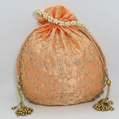 "traditional indian golden zardosi sequin embroider wedding giveaway bag potli | beautiful handmade gifting drawstring purse for woman Package Contents: 1 Size: 10\" x 8\" Designed with the heart, this beautiful Potli or batawa bag are eye catchy and made of premium material. Key Features: Zardosi embroidery art work. This potli is good match with both Indian and western outfits and are superb for wedding and festive parties. This would be best complement to your designer saree, lenhga or any ot Traditional Bags With Resham Embroidery For Festive Occasions, Party Pouch With Gota Work For Festivals, Festive Bags With Gold Embroidery For Gift, Gold Embroidered Potli Bag For Party And Festivals, Gold Embroidered Potli Bag For Festivals And Parties, Gold Zari Work Bag For Diwali, Bollywood Dori Work Potli Bag For Party, Gold Bags With Zari Work For Diwali, Bollywood Style Potli Bag With Resham Embroidery For Party