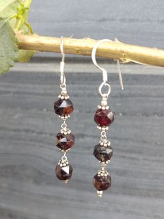 Garnet gemstone faceted rondelle beaded silver earring , earring gift for her, garnet faceted rondelle earrings, boho earring, every day earrings, gift for daughter, gemstone faceted rondelle  sterling silver earrings hand made with love and passion. Item: garnet earring pair  Metal: sterling silver Metal purity: 92.5% Length: 5.5 cm Elegant Gemstone Beaded Earrings For Gift, Garnet Round Beads Jewelry For Gifts, Garnet Gemstone Beads Jewelry As A Gift, Garnet Gemstone Beads Jewelry For Gifts, Garnet Jewelry With Round Beads For Gifts, Sterling Silver Dangle Earrings With Faceted Beads, Gift Jewelry With Faceted Garnet Beads, Handmade Elegant Garnet Earrings, Gift Jewelry With Garnet And Faceted Beads