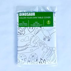 the dinosaur table cover is white and green