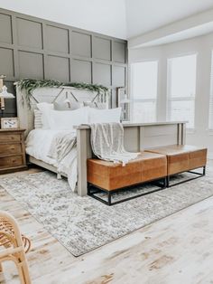 a bedroom with a bed, dresser and chair in it's centerpieces