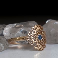 A Timelessly beautiful Victorian Style Gold ring set with a Blue Sapphire and Flourished with Antique Floral patterns. Sheer beauty and Elegance in this Charming treasure of a ring. Perfect to Wear Everyday or to special event. This Victorian Style Ring is decorated with a 12mm Wide and long Pattern. Made with Your Choice Gold Karat That can be chosen from the menu on this page. All rings Sizes available The Sapphire is 2.5mm Natural Cabochon, All other Stone requests are welcome * All items Han Medieval Ring, Victorian Style Rings, Antique Floral, Gold Ring Sets, Fantasy Jewelry, Vintage Ring, Victorian Style, Antique Rings, Stackable Rings