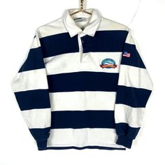 Vintage Barbarian Rugby Shirt XS Multicolor Striped Made IN Canada Size/Measurements (Based in inches) Size - XS Pit to pit - 18.5" Length - 26" Shoulder to cuff - 22.5" Condition / Details Yellowing on the back Slight stain on the front Stained collar Combined Shipping: We provide combined shipping, please contact us for a quote White Long Sleeve Shirt With Contrast Stripes, Navy Long Sleeve Tops With Contrast Stripes, Navy Long Sleeve Top With Striped Collar, Retro White Long Sleeve Top, White Retro Long Sleeve Top, Navy Long Sleeve Top For College, Retro Long Sleeve Navy Top, Navy Retro Long Sleeve Top, Striped Long Sleeve Tops For College