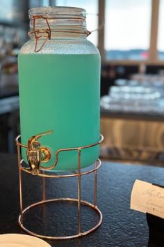 a large blue liquid in a metal holder