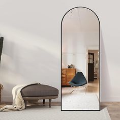 an arch shaped mirror in the middle of a room