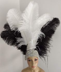 We make and ship our items really fast if you need it for a specific date please let us know. or call/text us at 954-3051817 to complete your order over the phonePrime wing Ostrich Plumes Feathers Carnival Headdress Showgirl  on a Crystal Rhinestone tiara/crownHeaddress approximate height including crown is approx 22"Prime quality Ostrich feathers in white and blackSecured with a glitter elastic band A miamifeathers originalAll the items are new!Please Note regarding shipping:Even though deliver White Costume Hats And Headpieces For Carnival, Costume Party Hats With Ostrich Feathers, Ostrich Feather Trim Hat For Costume Party, Costume Party Hat With Ostrich Feather Trim, Carnival Headdress, Xmas Makeup, Feather Headdress, Rhinestone Tiara, Vintage Carnival