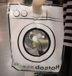 a paper bag with an apple logo hanging from it's side, in the shape of a washing machine