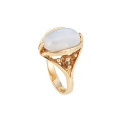 Stylish vintage moonstone cocktail ring (circa 1960s to 1970s) crafted in 10 karat yellow gold.  Cabochon moonstone measures 13.5mm x 9mm. The moonstone is in very good condition and free of cracks or chips.  The luminous moonstone glows with every movement of the hand, securely set in a bezel style mounting. The cocktail ring makes a nice statement on the hand. The medium rise ring (9mm - 0.35 inches) sits comfortably on the finger.   The ring is in very good condition and was lightly cleaned a Luxury Yellow Gold Cabochon Moonstone Ring, Vintage Yellow Gold Oval Moonstone Ring, Fine Jewelry Yellow Gold Oval Cabochon Moonstone Ring, Collectible Oval Cabochon Moonstone Ring, Oval Cabochon Moonstone Ring In Yellow Gold, Heirloom Yellow Gold Moonstone Cabochon Ring, Heirloom Oval Moonstone Ring, Classic Gold Moonstone Ring, Hallmarked Yellow Gold Moonstone Ring