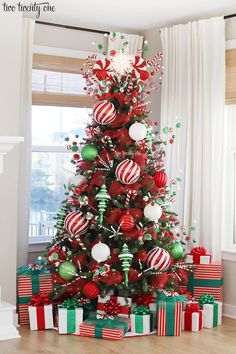 a christmas tree decorated with red, green and white ornaments