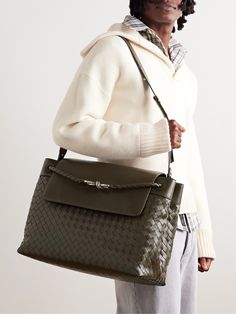 “Real luxury requires time, " says Bottega Veneta, each bag is measured in the amount of days, not hours, it requires to create. This Italian-made 'Aven' tote bag is intrecciato-woven from soft leather and accented with a knotted silver-tone hook. Two internal compartments will keep essentials like your phone, wallet and keys organised. Office Shoulder Bag With Intrecciato Weave, Designer Intrecciato Satchel Bag, Designer Satchel Bag With Intrecciato Weave, Designer Intrecciato Weave Satchel Bag, Formal Satchel Bag With Intrecciato Weave, Designer Intrecciato Office Bag, Designer Intrecciato Weave Office Bag, Luxury Satchel With Intrecciato Weave As Shoulder Bag, Designer Formal Bag With Intrecciato Weave