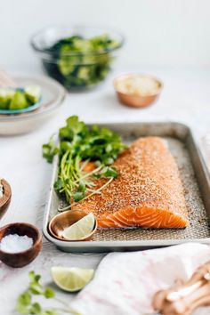 the salmon is prepared and ready to be cooked in the oven with other ingredients around it