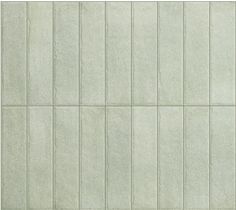 a white tile wall with vertical lines on it