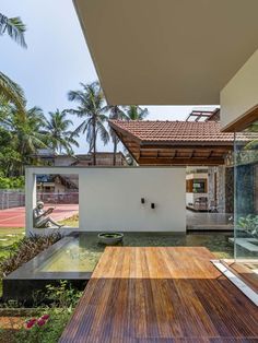 an outdoor area with a wooden deck and water feature