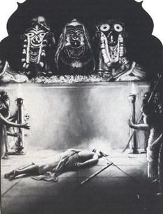 a black and white photo of people in front of a shrine with skeletons on the floor