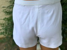 Here is a pair of vintage white polyester mans Tennis shorts . Made by Puma.Size says 36.Elastic Waist Measures 36”.Front has a pocket on each side.Left leg has a blue circle design.Shorts zips and hook.Nice vintage condition.Please take special note of measurements. 1970s sizing was much smaller than today’s standards. Please email me first if you live overseas for shipping cost. Price quoted is for USA only Casual Fitted White Athletic Shorts, White Stretch Boxer Briefs, White Stretch Short Length Boxer Briefs, Stretch Short Length White Boxer Briefs, White Boxer Briefs With Elastic Waistband, White Short Boxer Briefs With Elastic Waistband, White Relaxed Fit Casual Boxer Briefs, Casual Relaxed Fit White Boxer Briefs, Casual White Short Length Boxer Briefs