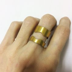 This is handmade ring made from a bronze sheet which is then soldered and finally gold plated. MATERIALS:24ct gold plated bronze DIMENSION:2 cm height(0,8 inch approximately) I can make this ring to your size.You can find your size by looking here:http://www.bluenile.com/pdf/bluenile_ringsizer_copyright2008.pdf Every ring is handmade and unique. You will receive a very similar to the photo but not identical. I will pack your ring in a gift box as in my last photo. This ring will be shipped 5-10 Unique Gold-colored Copper Rings, Hand Forged Gold Wide Band Ring, Unique Gold Copper Rings, Hand Forged Gold Wide Band Ring Gift, White Crystal Ring, Gold Ear Jacket, Front Back Earrings, White Opal Ring, Organic Rings