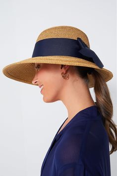 Toucan Hats makes our best-selling and beloved beach accessories.This bow-trimmed hat offers pretty protection from the sun with a nautical navy ribbon detail. Wear to the beach with your favorite caftan for a classic, feminine, and practical finishing touch. The best part? It's packable so it will easily fit in your suitcase or weekender, and keeps its shape after you pull it out. Wide brim Navy bow detail Packable Material: Woven Straw Chic Sun Hat With Bow For Vacation, Chic Vacation Sun Hat With Bow, Chic Straw Hat With Bow For Vacation, Chic Vacation Straw Hat With Bow, Chic Beach Sun Hat With Bow, Adjustable Wide Brim Navy Sun Hat, Adjustable Navy Wide Brim Sun Hat, Navy Adjustable Wide Brim Sun Hat, Chic Boater Hat With Bow For Vacation