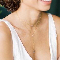 "Our Rowan double strand bridal Y drop necklace provides just the right amount of subtle sparkle for your wedding day!  This gorgeous crystal wedding necklace would be the perfect accent for a deep V neck wedding dress.  This bridal necklace is available in sterling silver, gold or rose gold filled and is one of our favourite new pieces of bridal jewelry.  This shorter layer has a beaded bar of three 4mm round crystal beads.  The longer Y drop layer has a 4mm round crystal bead a the connection Deep V Wedding Dress Jewelry, Necklace For Deep V Dress, Elegant Rose Gold Crystal Necklace For Wedding, Wedding Lariat Necklace With Cubic Zirconia And Adjustable Chain, Double Strand Delicate Chain Wedding Jewelry, Teardrop Pendant Crystal Necklace For Wedding, Dainty Drop Backdrop Necklace For Wedding, Wedding Lariat Necklace With Teardrop Delicate Chain, Delicate Double Strand Necklace For Wedding