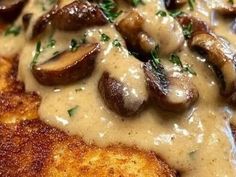 mushrooms covered in gravy on top of bread