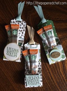 three starbucks coffee bags hanging on a table with the words instant starbucks's coffee break trip