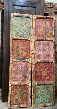 an old wooden door with floral designs painted on it