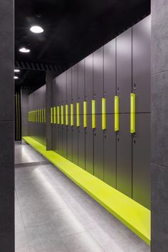 a row of yellow and gray lockers in a hallway