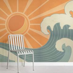 a white chair sitting in front of a wall with an orange and blue mural behind it