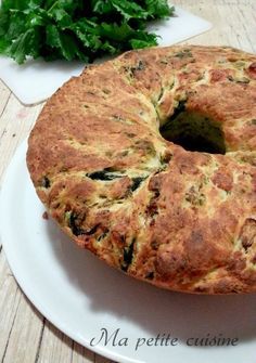 a bundt cake sitting on top of a white plate next to some parsley