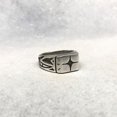 The ultimate star-gazing, night-stalking, street-walking companion ~ represent your inner kozmik verbiage in pure style with Cosmic Artifact's celebrated signet ring ~ ! Measurements ~ Top border 19mm x 4mm, band width 9mm and tapers to 5mm ~ Measurements may slightly vary across sizes Sizing ~ Please visit cosmicartifact.com/pages/ring-sizing for all sizing guides and information. Make Times ~ Each piece is made-to-order. This piece will be hand-carved from jewellers wax and cast in precious solid silver ~ Please allow 3-4 weeks before shipment. Shipping ~ All pieces come with free worldwide shipping ~ ! You can also find me online at www.cosmicartifact.com or connect via instagram.com/cosmicxartifact facebook.com/cosmicxartifact For Custom + Enquiries ~ Please be in touch via studio@cosm Silver Sterling Silver Signet Ring, Adjustable Symbolic Signet Ring Stamped 925, Adjustable Sterling Silver Spiritual Signet Ring, Adjustable Sterling Silver Signet Ring, Adjustable Silver Etched Signet Ring, Adjustable Etched Silver Signet Ring, Brutalist Sterling Silver Signet Ring, Brutalist Sterling Silver Signet Ring Gift, Cast Rings