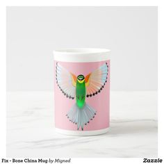 a cup with a colorful bird on the front and back of it's wings