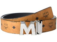 MCM Claus Reversible Belt - Belts : Cognac : Keep your opulent options open wearing the MCM Claus Reversible Belt. The M buckle is detachable, allowing for the strap to be cut to a customizable fit. Leather belt with a silver-tone logo shaped buckle. Single hardware strap keeper. Reversible design. Spot clean. Imported. Measurements: Width: 1 3 4 in First Hole Length: 47 in Last Hole Length: 43 in Weight: 10 oz Luxury Business Belt With Tang Buckle, Luxury Business Belts With Tang Buckle, Luxury Leather Belt Buckles With Tang Buckle, Luxury Silver Belt Buckles For Business, Luxury Formal Belts With Silver Buckle, Luxury Formal Belt With Silver Buckle, Luxury Leather Belts With Silver Buckle, Luxury Removable Belt For Business, Luxury Silver Belts With Palladium Hardware