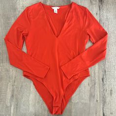 Soft & Stretchy V-Neck Bodysuit In A Beautiful Bold Orange Color. Never Worn - Like New, No Flaws. V Neck Bodysuit, Bright Orange, Color Orange, Orange Color, Like New, Womens Tops, V Neck, Orange, Women Shopping