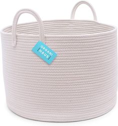 a white basket with a blue tag on it