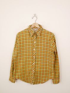 "Vintage 1980's Women's Yellow/Brown checked  Cotton Flannel Shirt. Measurements Length: 25\" Armpit to armpit: 21\" Armpit to end of sleeve: 18\" Condition: Gently used, There's no stains or holes. Good condition. ※Please read the policy before you purchase※" Vintage Yellow Printed Shirt, Yellow Flannel Shirt, Casual Yellow Button-up Flannel Shirt, Vintage Brown Cotton Flannel Shirt, Vintage Plaid Button-up Flannel Shirt, Wool Shirt, Stretchy Pants, Ribbed Leggings, Gray Plaid