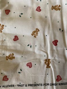 the fabric has hearts and teddy bears on it