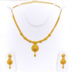 This 22k gold necklace set features an extravagant checkered drop design, radiating opulence and elegance. Weighing 30.0 grams, the set boasts a luminous yellow gold finish with a 16-inch necklace, adjustable by 1.75-inch links, and secured with a hook lock. The set includes matching earrings, each 1.75 inches long with screw-back posts for secure and comfortable wear. The intricate checkered pattern combined with the luxurious drop design makes this set perfect for those who appreciate bold and sophisticated jewelry, ideal for grand occasions and statement looks. PRODUCT DETAILS Gold Purity(karat): 22k Gold Weight(grams): 30.0 Item Finish: Yellow Gold Set Length: 16" Drop Length: 1.8" Adjustable Links: 1.75" Links Lock Style: Hook Lock Matching Earrings: Included Earring Length: 1.75" Ear Yellow Necklace For Formal Festive Occasions, Yellow Necklace For Festive Formal Occasions, Yellow Formal Necklace For Festive Occasions, Festive Yellow Necklace For Formal Occasions, Yellow Festive Formal Necklace, Formal Yellow 22k Gold Jewelry, Formal Yellow 22k Gold Chain Necklace, 22k Gold Necklace Set, 22k Gold Necklace